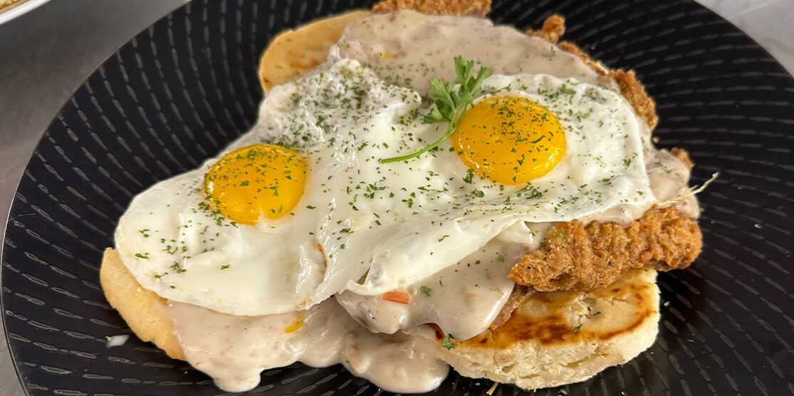 Biscuits and Gravy topped with Country Fried Steak, a class breakfast made famous by ERA Pancakes & Cafe in Rib Mountain, WI